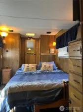 Queen size bed fits comfortably. Lots of storage with built-in dresser and closet.