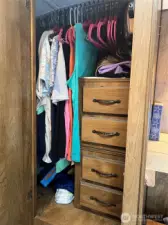 Right door has more space for hanging clothes, drawers. Not shown is the third door with lots of space for hanging clothes.