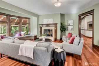 Living room with gas fireplace and bay window.