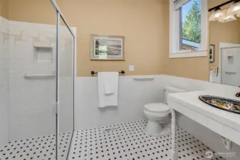 In-suite bath with level shower entrance.