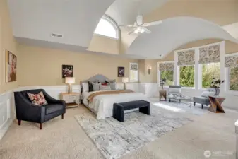 Primary suite is light and bright with high ceiling detail.