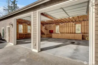 Garage/shop #4. 10x10' doors, 42x30 sq. ft. w/cabinets and loft above can easily be enclosed.