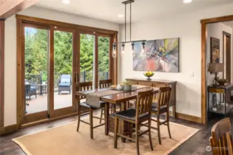 Beautifully upgraded French doors in the dining room seamlessly transition to a freshly constructed deck, offering fabulous outdoor living space.