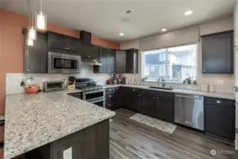 Stainless steel appliances, quartz counters & a walk-in pantry are sure to impress.