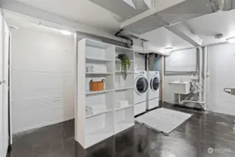 Utility room with an abundant storage and utility sink.