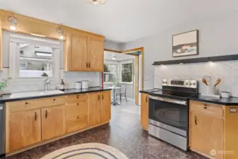 Spacious kitchen that leads to the breakfast nook (and door to the side patio).