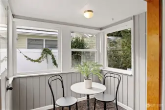 Breakfast nook with door to the exterior, side patio.