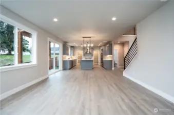 Living room looking back at the kitchen and dining area