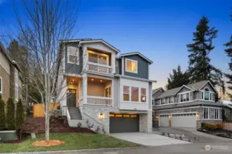 Exterior features with white wash stone, cedar T&G, custom railing, EV Charger & WIFI Garage door opener