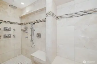 Step into the expansive, tiled shower where clean lines & ample space create a spa-inspired escape designed for ultimate relaxation.