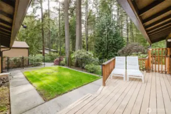This gated front yard features a spacious front deck - enjoy the tranquility of your surroundings in style!