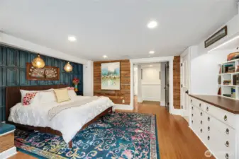Enter through the French Doors into this Primary bedroom that has plenty of storage with built-in drawers, shelves &  additional closet in seperate from the walk-in closet with organziers.
