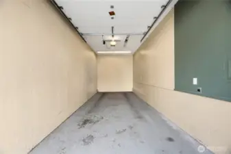 Enormous Garage is extremely tall and deep. It is power and plenty of space for storage.  Just across from your front door and next to the Swimming Pool, everything is conveniently located.