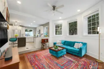 Just off the luxurious kitchen is this inviting living room with gas fireplace and an abundance of windows for natrual light.  Ceiling fan can also keep air conditioning or heating efficient.