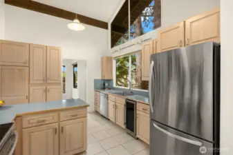 Such a cheery space! lots of natural light. Notice the wine fridge- got rid of the old trash compactor which no one ever uses and put in this in its place.