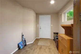 The room leading outside. Could be a small bedroom, mud room or?