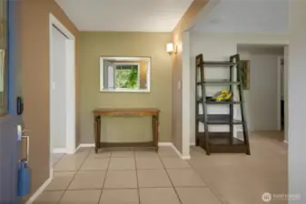 As you enter the home, real tile flooring in the entry and to the left, cushy carpet to your private living room.