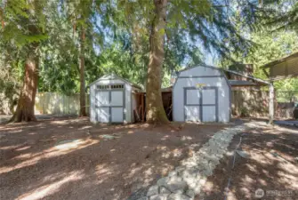 Two out buildings to the right of the property