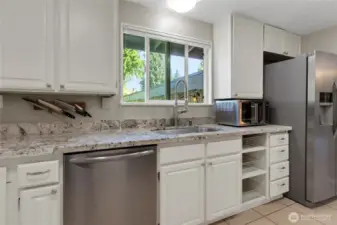 Closer view of the kitchen and pull outs to the right.