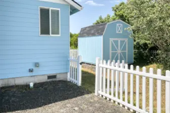 The 30 amp outlet is right by the back yard gate.  The storage shed is a wonderful addition to this property.