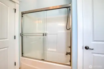Tub/shower combo in the bathroom.