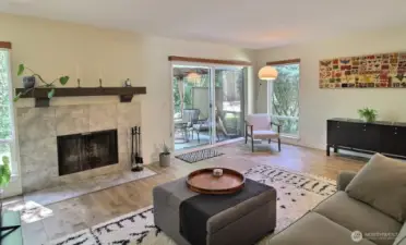 Cozy up next to the charming wood-burning fireplace—a beautiful focal point that adds warmth and character to the space.