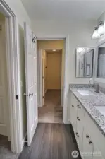 Upstairs bathroom also features dual access from the primary as well as the hallway, offering shared privacy and a clean, functional layout.