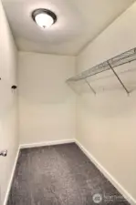 Spacious walk-in closet for ample storage and organization.