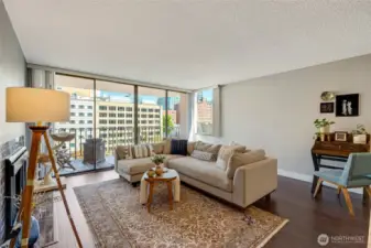 Open floor plan enhances the generous living room, featuring a beautiful gas fireplace.