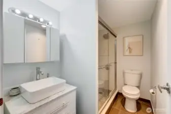 Updated bathroom featuring modern fixtures and finishes.