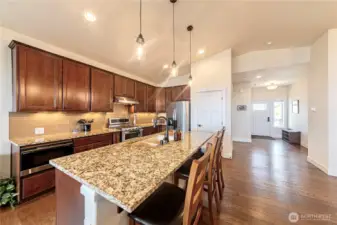 Entry onto Main level leads to Eat In Kitchen with Center Island and Pantry