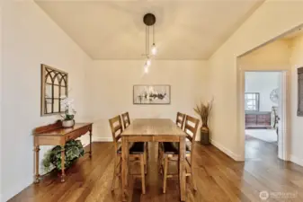 Main level dining area across from the kitchen island