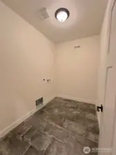 Downstairs FULL SIZE side by side laundry room with extra space