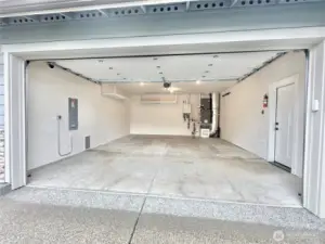 2 car garage with storage space and EV charging outlet