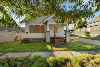 Freshly built front porch and entry stairs enhance the home’s curb appeal.