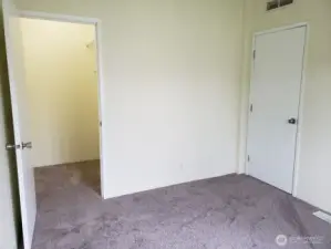 Second Bedroom has a Walk In Closet, Newer Interior Paint and Carpeting.