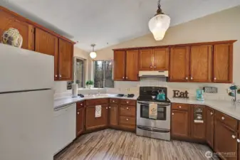 Oak cabinets and drawers offer storage for all your cooking necessities. Open area above the cabinets is great for plants, herbs or additional cooking devices.