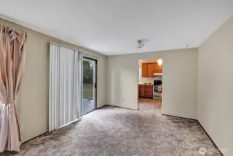Family room showing the slider to back deck and the access to the kitchen.