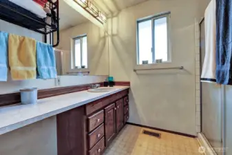 Private 3/4 bath for the Primary bedroom. Singel sink vanity with makeup station. Step in shower for your comfort and safety.