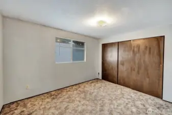 2nd bedroom on the upper level has window facing North. Room will easily accommodate a double bed and additional furniture.