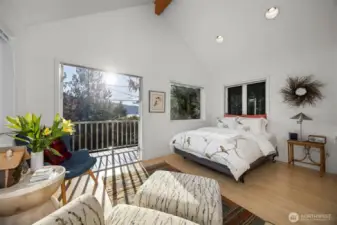 Another view of the sitting and sleeping areas with the lake views beyond.