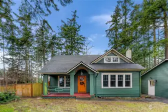 This enchanting 1900s farmhouse invites you to enjoy the serenity of country living on a private +/-0.63-acre lot. Surrounded by lush greenery, the home blends rustic charm with thoughtful modern updates, providing an idyllic retreat where you can savor peaceful mornings on the porch or explore the natural surroundings.