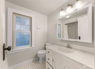 Primary en-suite bathroom with heated tile floors.