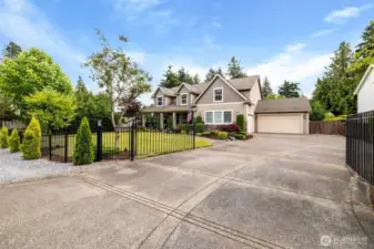 Nestled behind a gated entrance, this expansive residence has a 4-car garage, paid off solar panels and a host of modern amenities for both luxury and comfort.