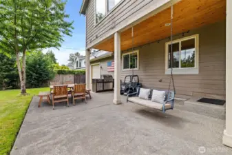 Let's explore the fully fenced backyard. Just off the family room, the covered patio extends your entertaining space outdoors.