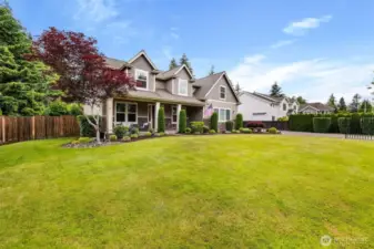 Close the driveway gate and the spacious front yard is fully fenced.