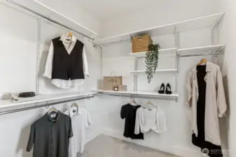 Spacious and functional walk-in closet with adjustable shelving. Plenty of great space for your wardrobe.