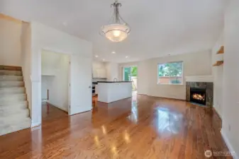 Inviting entry, hardwoods, updated kitchen, lots of storage under the stairs and a half bath with a pedestal sink. Enter from the front door or garage.