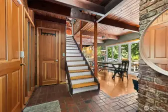 Soaring ceilings, natural wood walls, and exposed beams create a warm, lodge-like feel the moment you step inside.