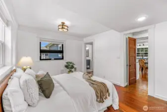 Large bright bedroom with closet and attached bathroom.